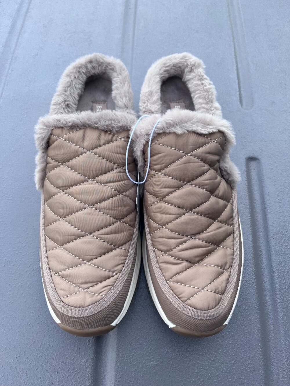 BareTraps women’s quilted slip-on shoes in taupe with soft faux fur lining.